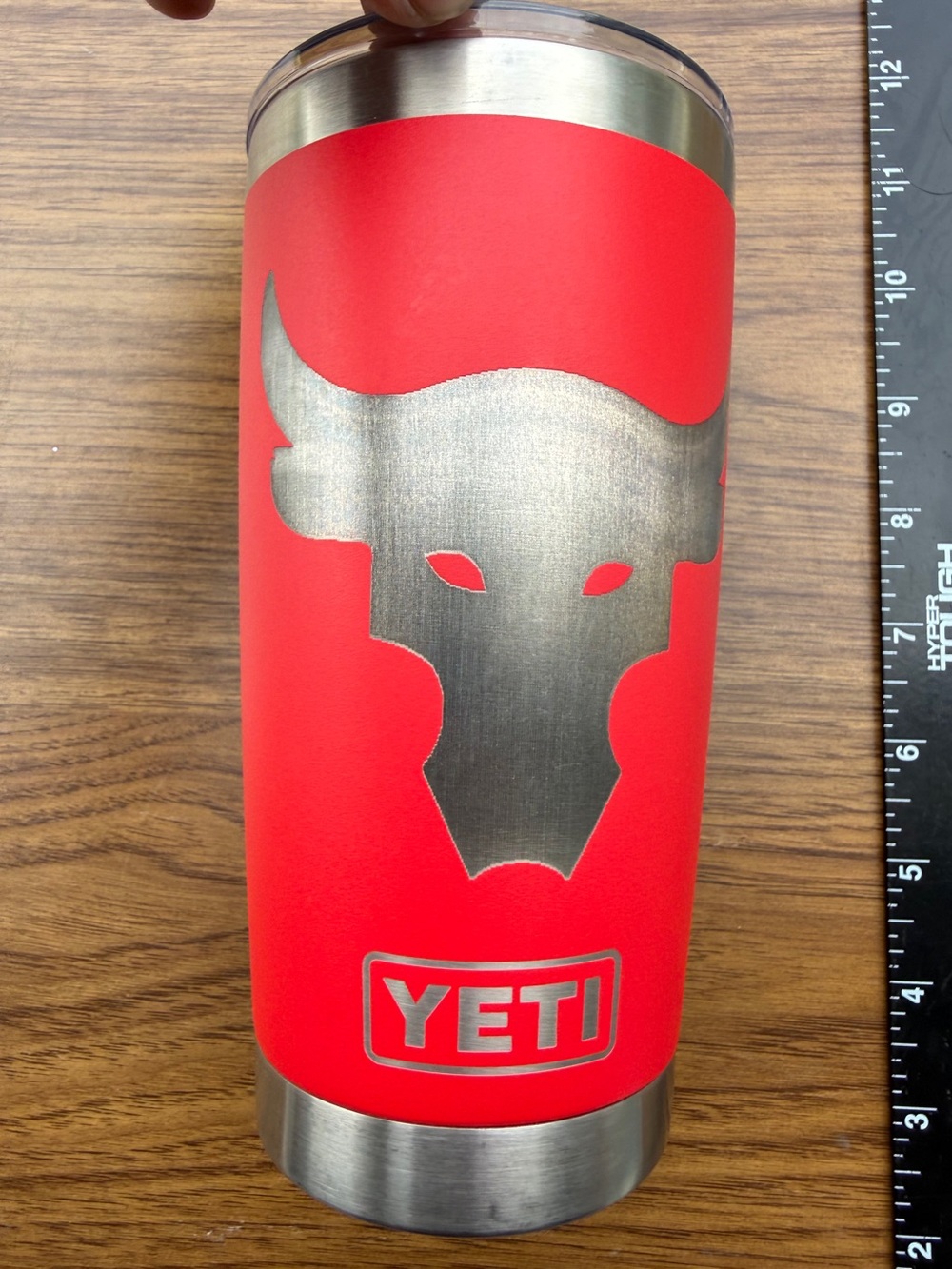 Yeti Rambler 20 oz red tumbler with silver bull head graphic